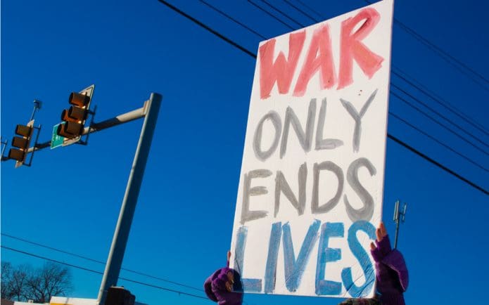US bombs syria - war only ends lives anti war protest sign