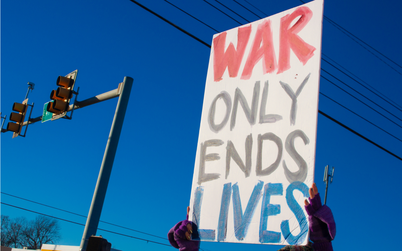 US bombs syria - war only ends lives anti war protest sign